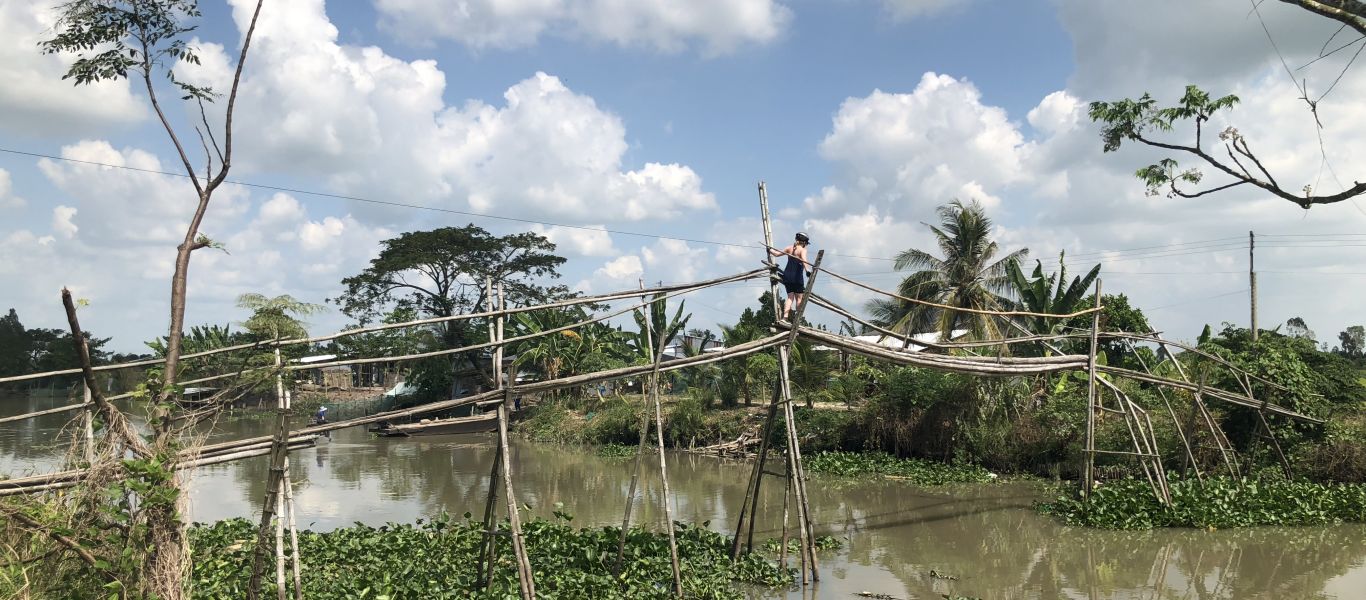Try to cross on one of monkey bridges In Mekong Deta